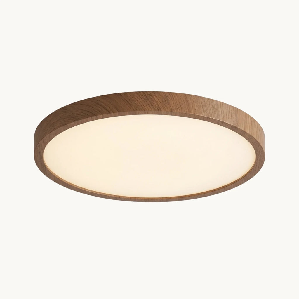 Plafonnier vu de dessous : diffuseur blanc opalin cerclé d'un contour effet noyer