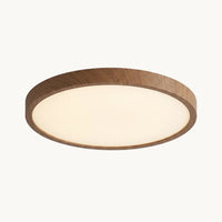 Plafonnier vu de dessous : diffuseur blanc opalin cerclé d'un contour effet noyer