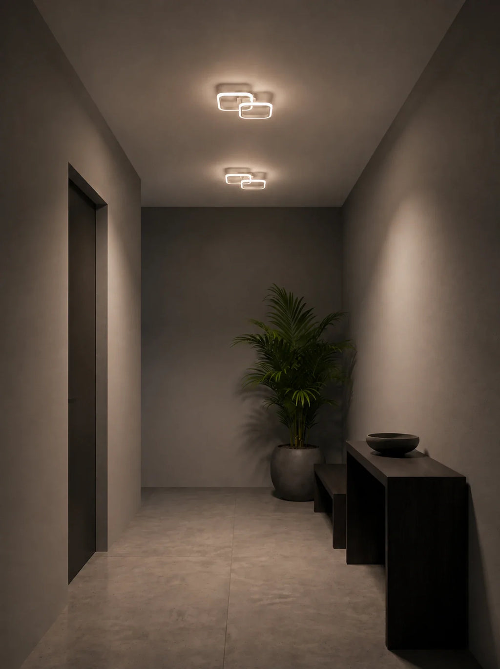 Deux plafonniers plats LED blancs Marly alignés au plafond d'un couloir, console et banquette de bois sombre